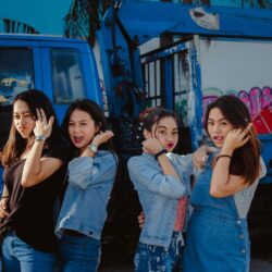 Young Women In Casual Wear Standing In Front Of A Truck